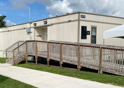 Image of temporary relocatable medical modular building with wooden ramp