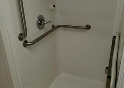 Handicap accessible shower in used modular fire station building