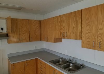 Kitchen Area with Sink, Cabinets, Appliance Hookups